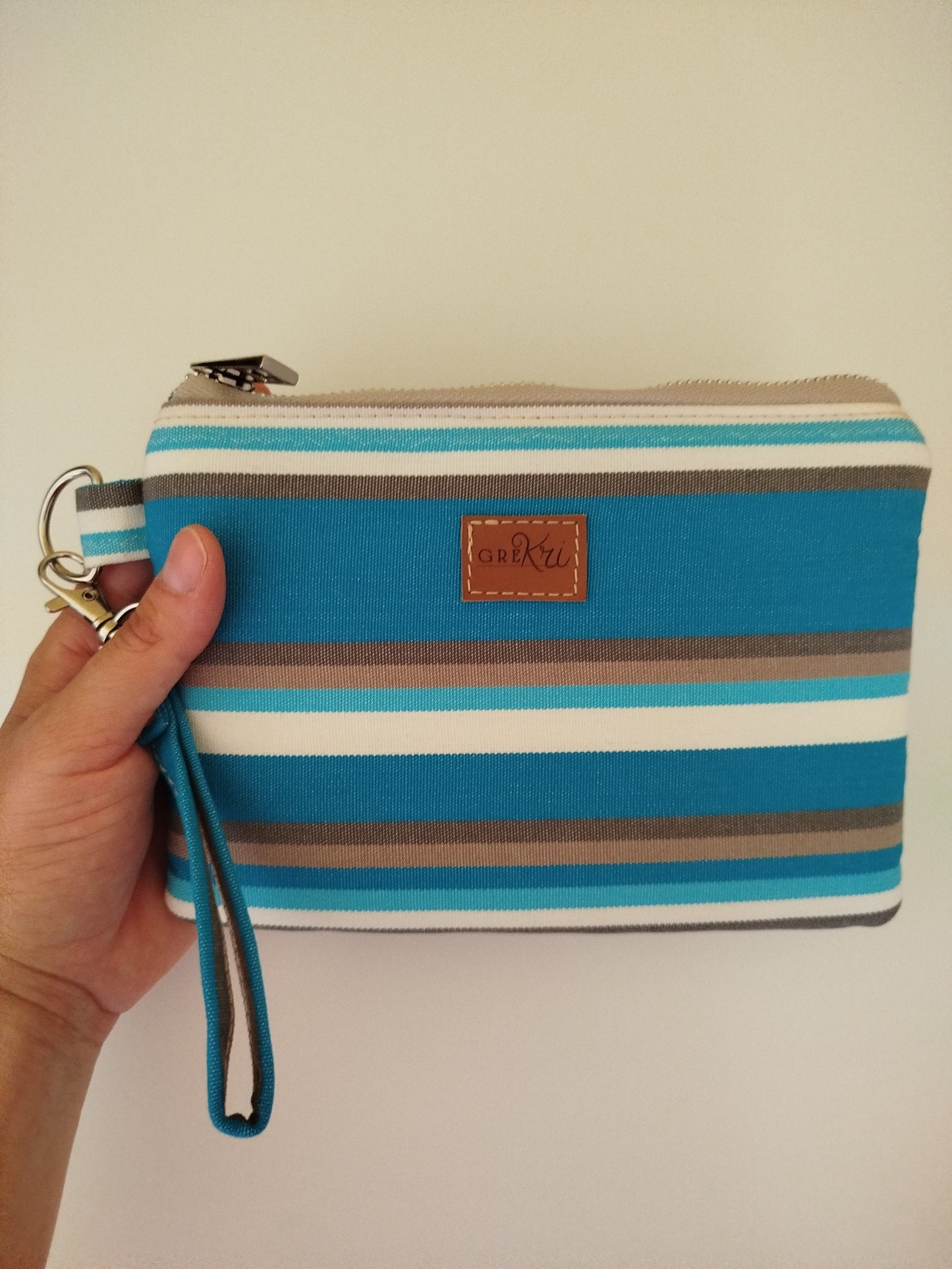 Mini pochette fantasia a righe